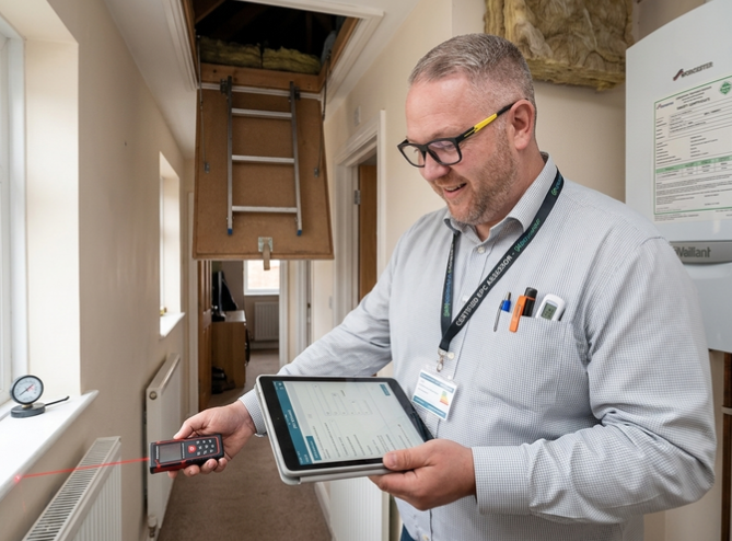 Paul carrying out an EPC assessment inside a Northampton home